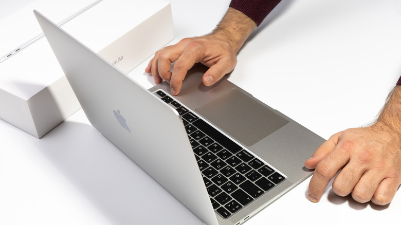 A picture of someone using the MacBook's trackpad