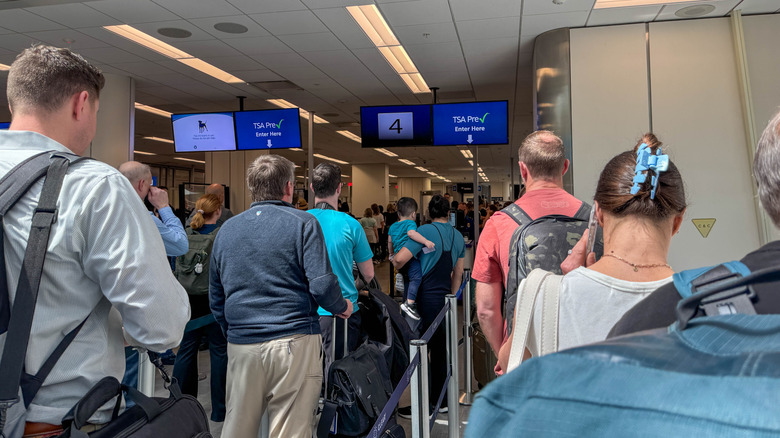 Two different lines filled with individuals for TSA Pre Check