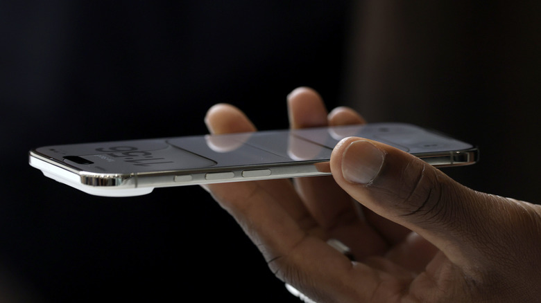 The iPhone Air in hand.