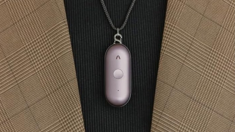 The Plaud NotePin S AI voice recorder worn as a pendant of a necklace.