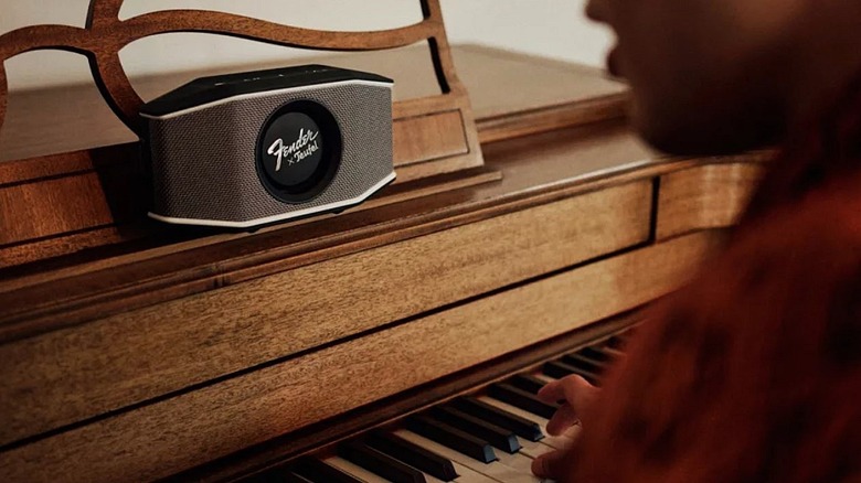 Fender x Teufel Rockster Go 2 speaker resting atop a piano.