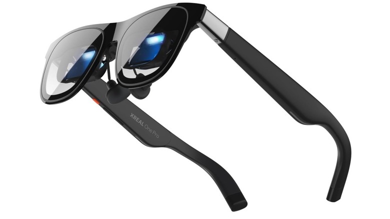 Black Xreal One Pro AR glasses with built-in display modules.