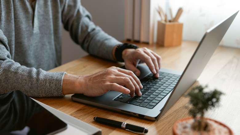 Typing on a laptop keyboard