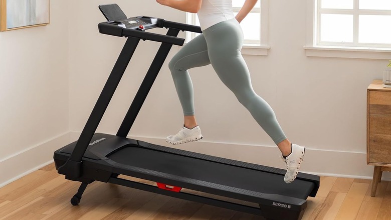 A woman running on the NordicTrack T Series 5 Treadmill.