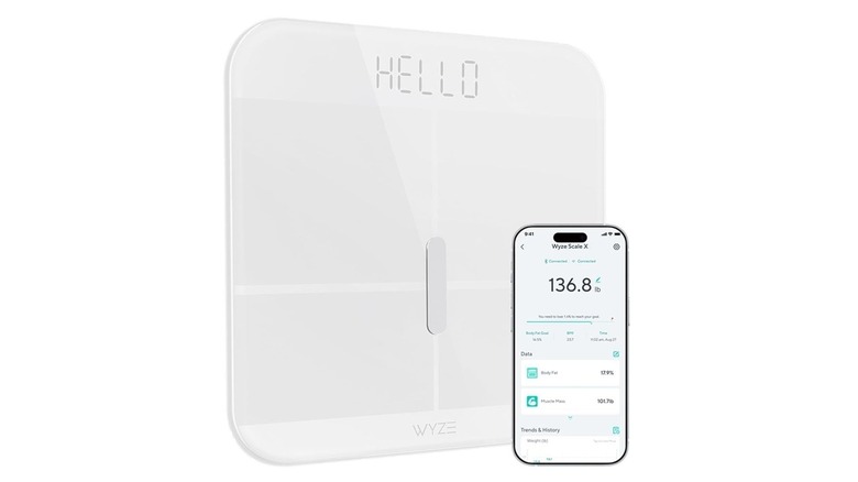 The Wyze Scale X and its companion app on a smartphone, on a white background.