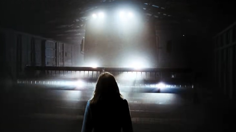 Woman stood in front of combine harvester in The Crazies