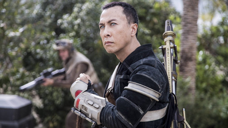 Chirrut Îmwe (Donnie Yen) standing defiantly in "Rogue One: A Star Wars Story."