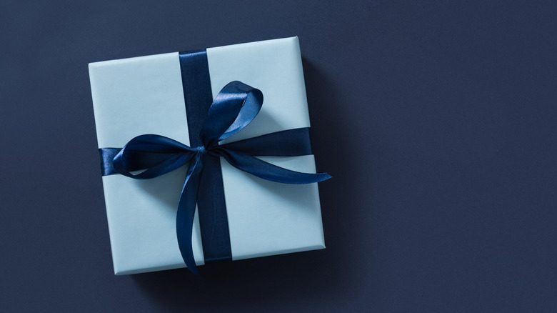 Blue gift box on a navy blue background