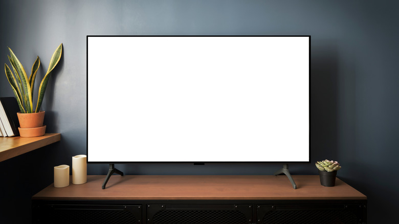 Smart TV on with a blank white screen in a living room setting.