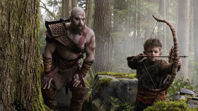 Kratos (Ryan Hurst) and Atreus (Callum Vinson) hunting in God of War