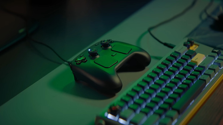 Steam Controller on a desk next to a mechanical keyboard.