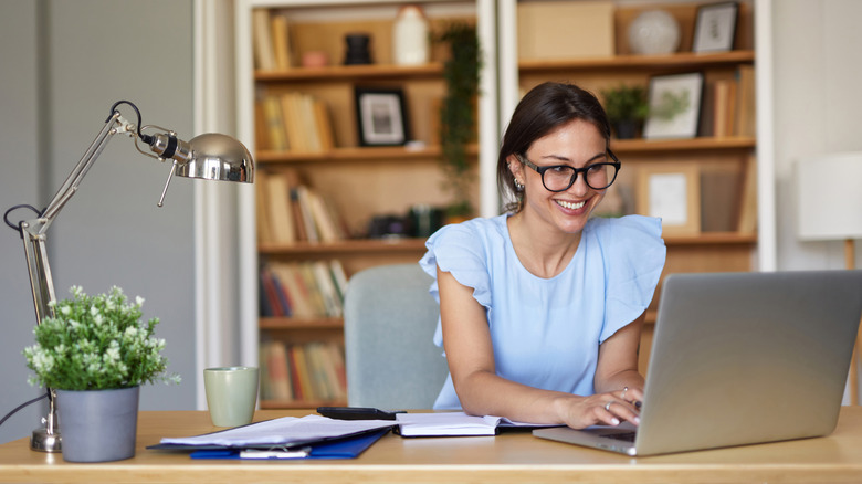 A woman working in her home office.