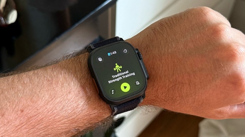 An Apple Watch Ultra 2 displaying watchOS 26's Workout app Traditional Strenght Training practice option