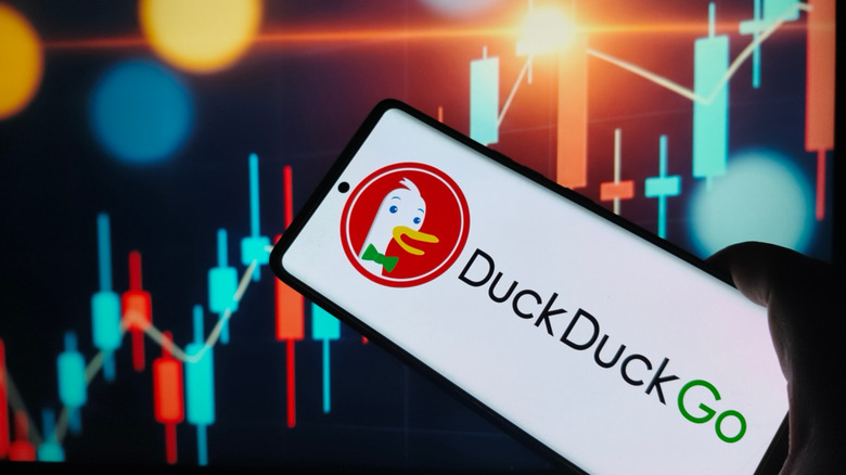 The DuckDuckGo logo is displayed on a phone.
