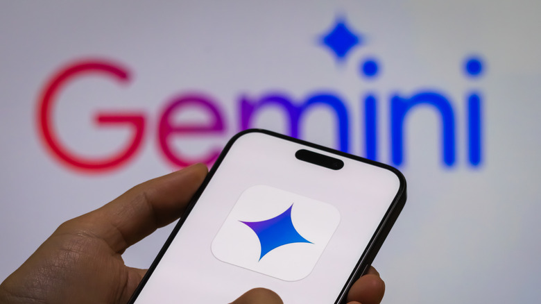 A Google smartphone with the Gemini logo and name Gemini in the backdrop