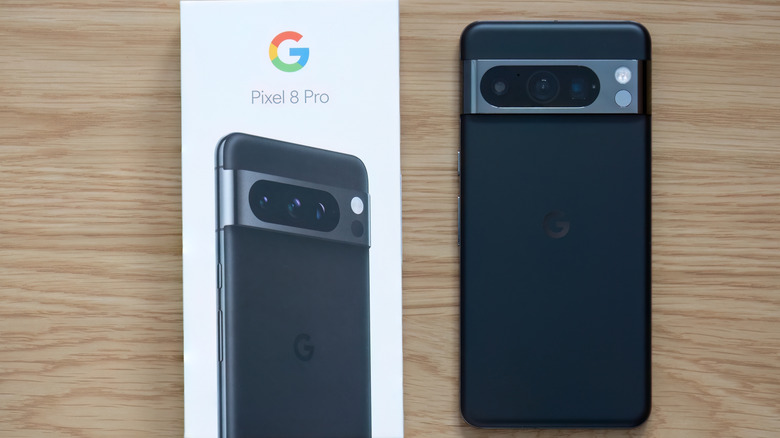 A Google Pixel 8 Pro and its packaging box