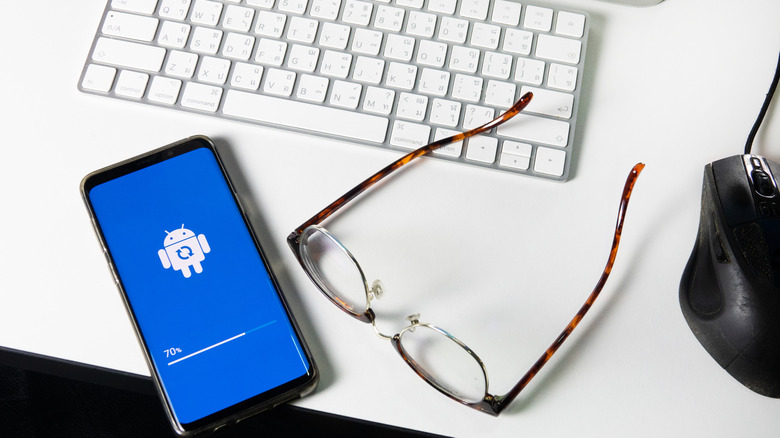 A concept showing a data transfer process between an Android phone and a computer.