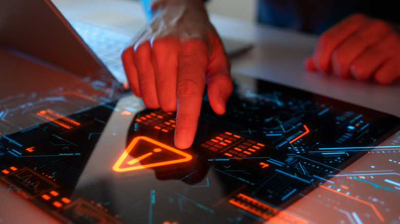 Artistic rendition of a hacker breaching a system