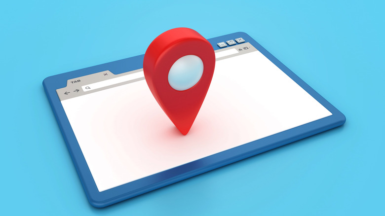 A tablet device with a 3D map location symbol on top of it.