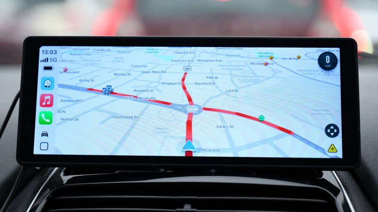Waze app interface on car display.