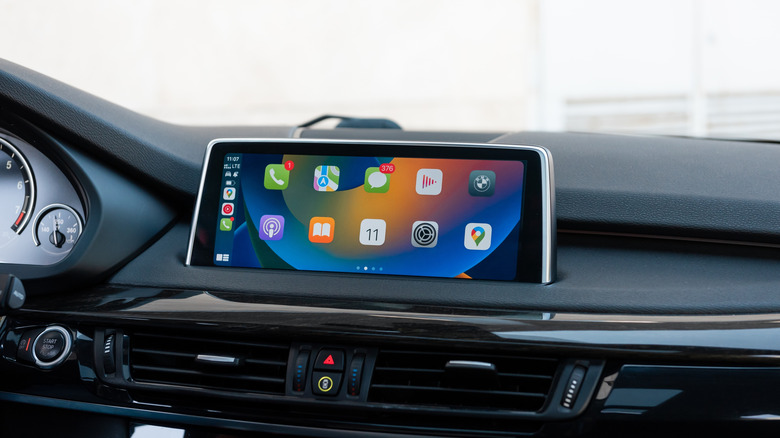 An Apple CarPlay screen showing various apps, including Google Maps