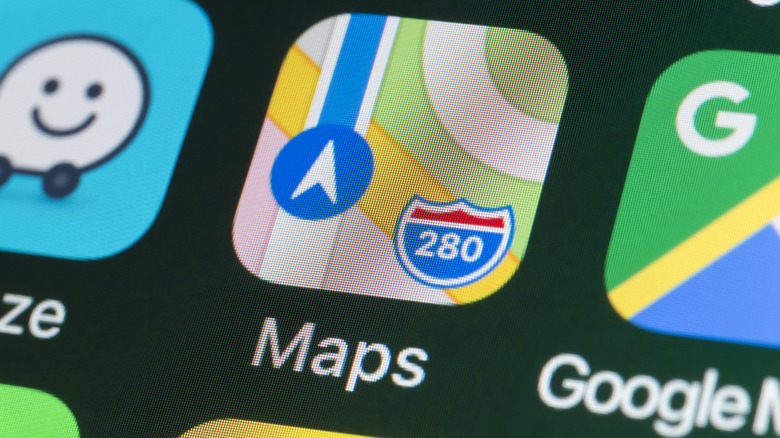 iPhone screen showing app icons for Waze, Apple Maps, and Google Maps