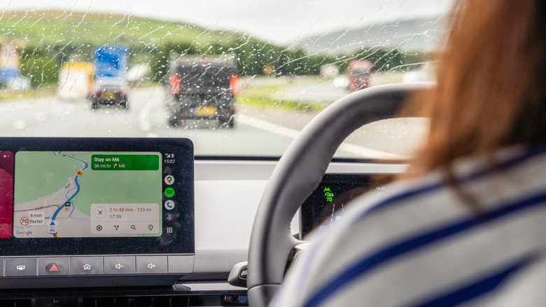Google Maps UI visible on a vehicle's main infotainment display.