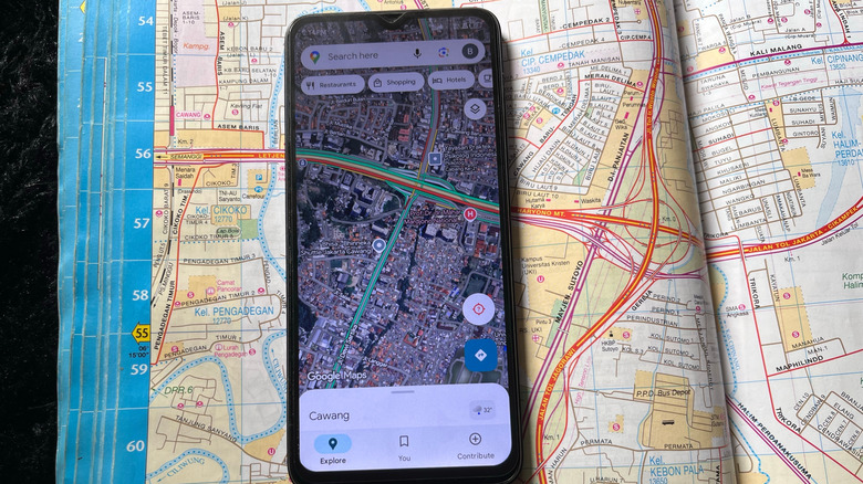 Google Maps open on a smartphone with a map in the background