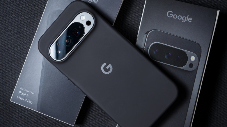 google pixel 9 pro on top of its box, back facing up with camera bar shown