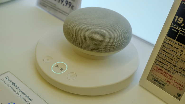 The Google Nest Mini 2nd generation device on display in a store in italy