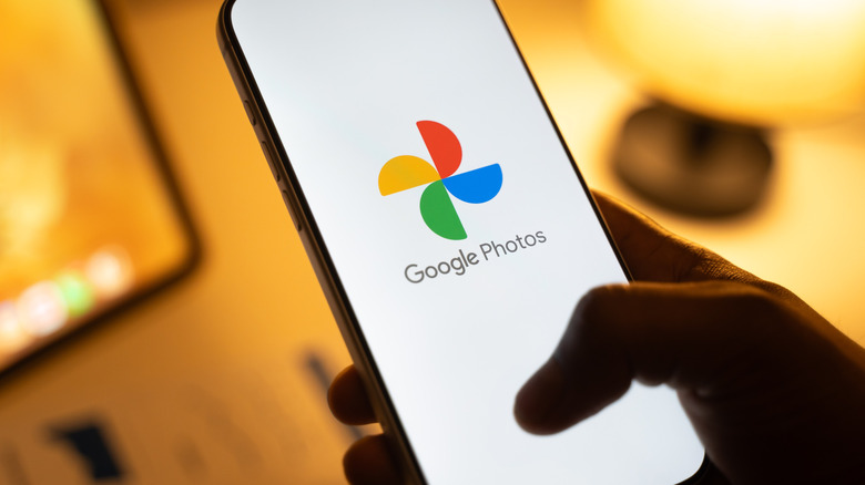 The Google Photos logo on a smartphone display.