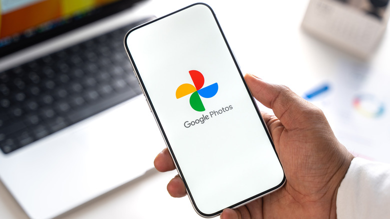 The Google Photos logo on a smartphone.