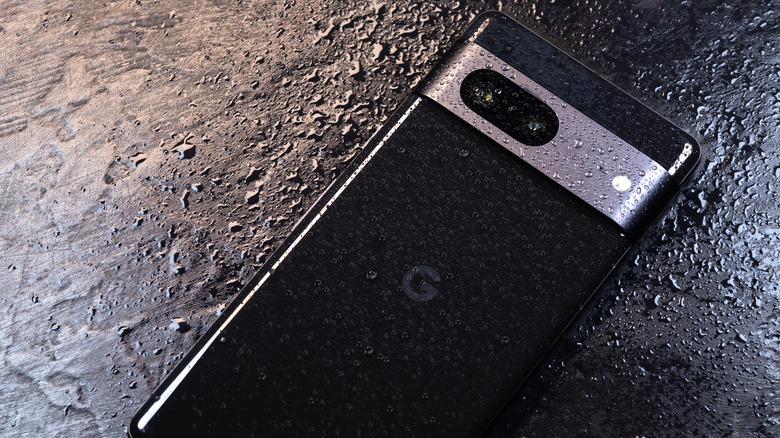 google pixel phone face down with water droplets on it