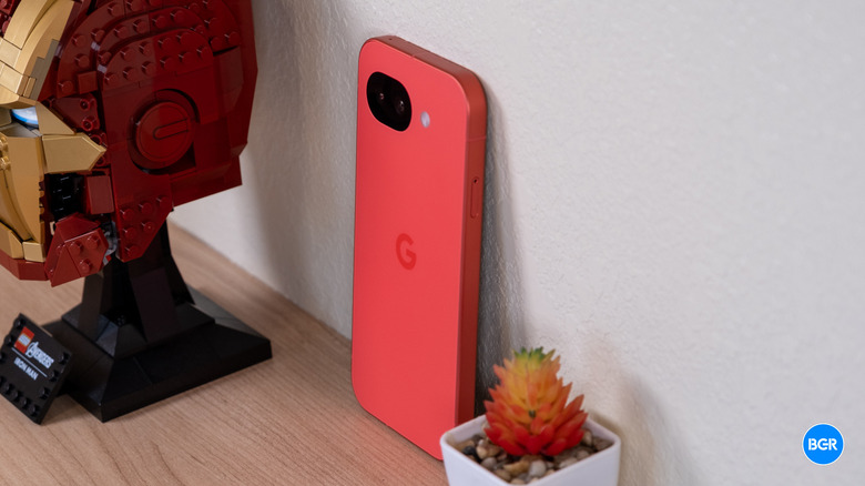 Google Pixel 10a leaning against a wall