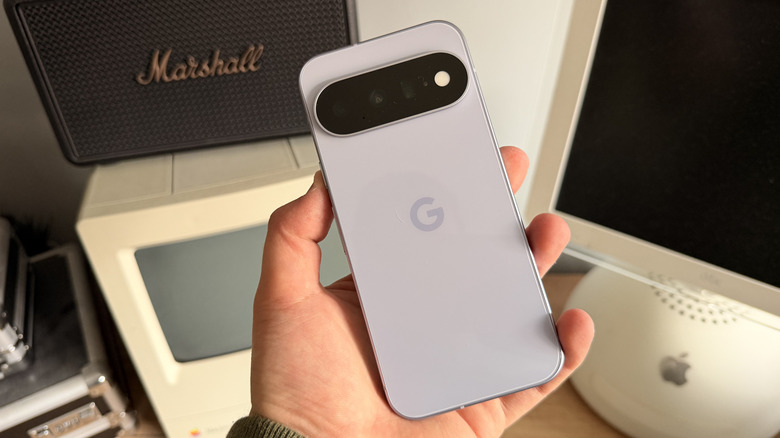 Pixel 11 being held in one hand at an angle