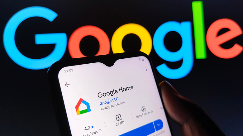 google home app on a smartphone screen with google logo on black background