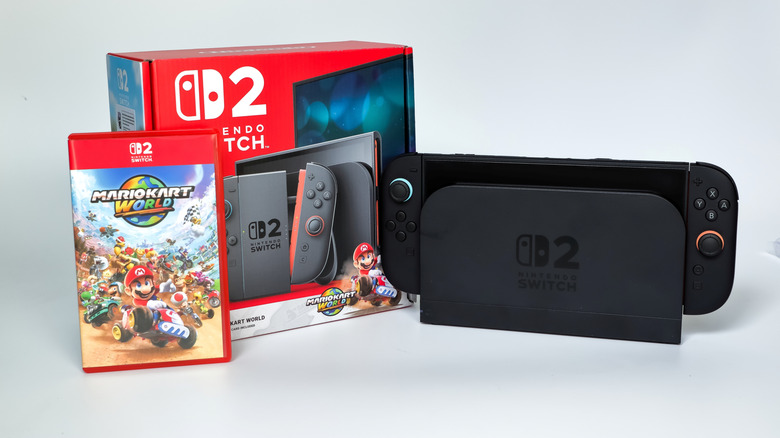 The nintendo switch 2 console with its package and mario kart world video game