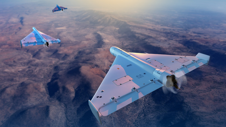 Military munition drones flying above a desert