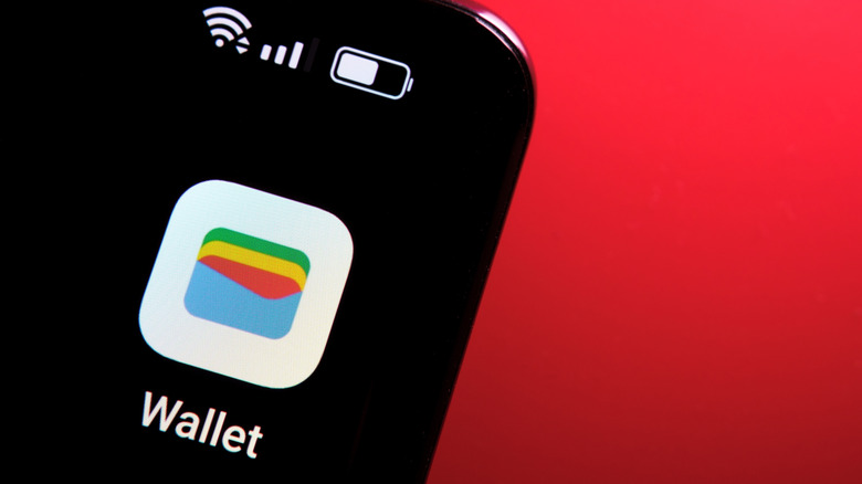 google wallet icon open on a smartphone with a red background