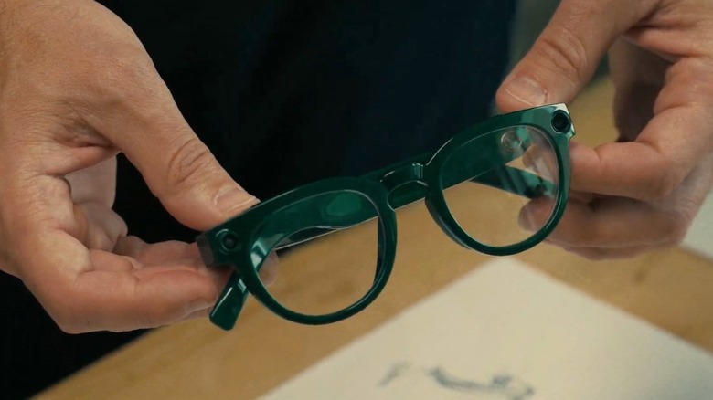 Close up of Warby Parker Google smart glasses frames held in hand.