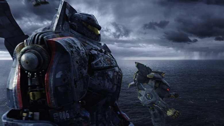 Two giant robots floating over the ocean in "Pacific Rim"