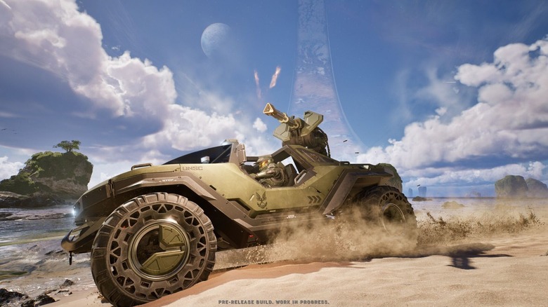 Master Chief in a Warthog, peeling out on the sandy beaches of Halo in Halo: Campaign Evolved