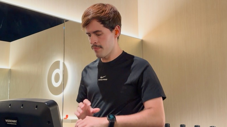 José running on a treadmill while testing the new Powerbeats Fit