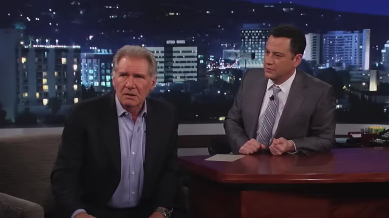 Harrison Ford looking out at the audience while appearing on Jimmy Kimmel Live