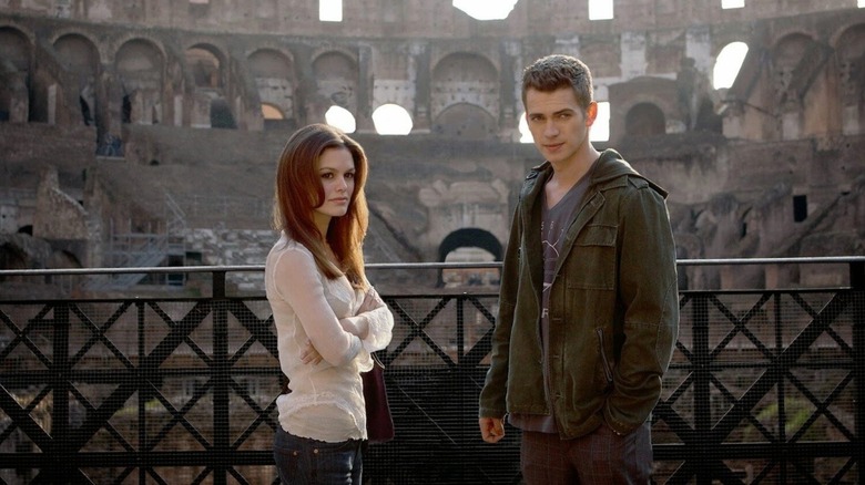 Millie and David standing in the Colosseum in Jumper