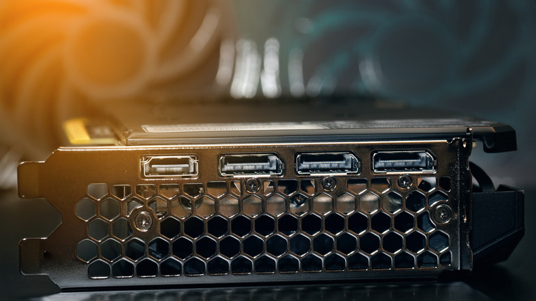 A photograph of HDMI and DisplayPort connectors on a graphics card.