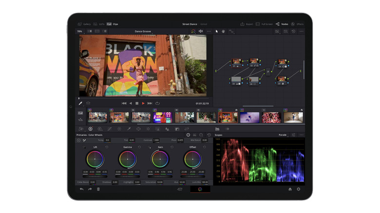 Tablet displaying a professional video editing app with a timeline, color grading controls, node graph, and preview of a dancer in a street scene.