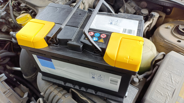 Car battery sitting on an engine block