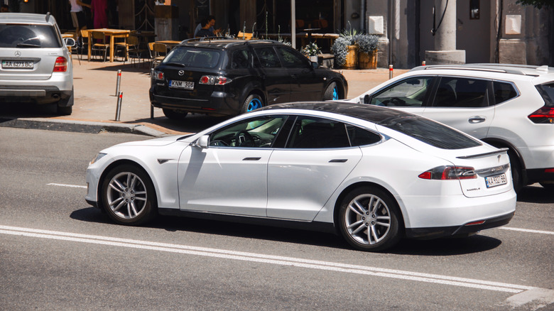 A white Tesla Model S on the road