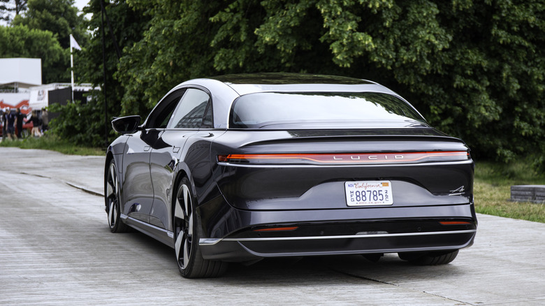a black Lucid Air EV on the road